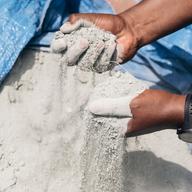 Kwesi Joseph digs into the basalt rock dust at the Hands and Heart Community Garden