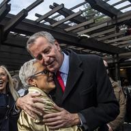Mayor Bill DeBlasio greets Liz Neumark at the opening of Wollman skating rink in Central Park on Nov. 14, 2021. Former New York City Mayor Bill de Blasio is dropping out of the crowded race.