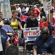 People marching with United Cerebral Palsy prepare to participate in the inaugural Disability Pride Parade in New York, Sunday, July 12, 2015.