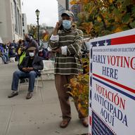 Westchester County residents stand in line to vote on the first day of early voting, Saturday, Oct. 24, 2020, in Yonkers, N.Y.