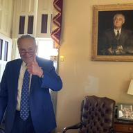U.S. Sen. Chuck Schumer, D-N.Y., gives a thumbs-up in his office after the Senate approved Democrats' big election-year economic package, in Washington, Sunday, Aug. 7, 2022. 