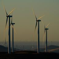 Wind turbines work on hills in Livermore, Calif., on Wednesday, Aug. 10, 2022