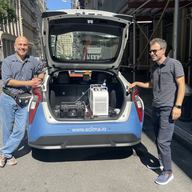 Aclima driver Ramses Diaz drives the morning shift through lower Manhattan, measuring air temperature in real time while listening to Brian Lehrer. Erald Xhaferaj (right), Aclima’s fleet manager, stan