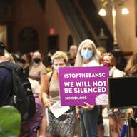 Opponents of a total ban on abortion gather in the lobby of the South Carolina Statehouse on Tuesday, Aug. 30, 2022, in Columbia, S.C.