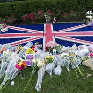 Flowers are seen laid outside the British Embassy in Washington, Friday morning, Sept. 9, 2022. 