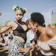 Two women dancing at a concert