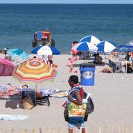Beachgoers enjoy a sunny day on the beach in Point Pleasant Beach, N.J. on July 15, 2019.