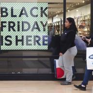 A 'Black Friday' sign is posted at a retail location in Philadelphia, Monday, Nov. 21, 2022. Bargain hunting is back with full force heading into the holidays.