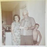 A young Jamie Brickhouse with his Mawmaw, and Pawpaw, who is enjoying a slice of chocolate meringue pie.