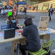 WNYC's table at a Street Lab pop up on Fordham Road in the Bronx