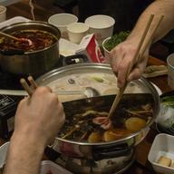Dishes of food arranged on a tabletop.