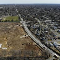 A plot of land that is being developed into multifamily housing, bottom left, is seen in East Northport, N.Y., Thursday, March 16, 2023.
