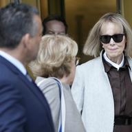 Former advice columnist E. Jean Carroll, right, leaves Manhattan federal court with her attorneys, Tuesday, April 25, 2023, in New York.