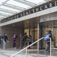 People enter New York City Health Hospitals Gouverneur Health building, Tuesday, Jan. 8, 2019, in New York. 