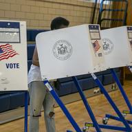 People vote at the Anning S. Prall Intermediate School in the Staten Island borough of New York City on Tuesday, June 28, 2022.