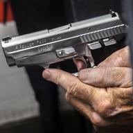 John Deloca, owner of Seneca Sporting Range, prepares to fire his 9mm semi-automatic handgun during a shooting demonstration at his gun range, June 23, 2022, in New York. 