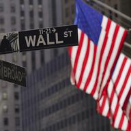 American flags fly outside the New York Stock Exchange, Friday, Sept. 23, 2022, in New York. The latest round of corporate earnings is leaving Wall Street with a confounding sense of relief and linger