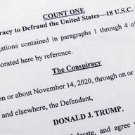 The indictment against former President Donald Trump charging him by the Justice Department for his efforts to overturn the results of the 2020 presidential election is photographed Tuesday, Aug. 1, 2