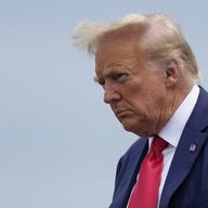 Former President Donald Trump arrives at Ronald Reagan Washington National Airport, Thursday, Aug. 3, 2023, in Arlington, Va., as he heads to Washington to face a judge on federal conspiracy charges a