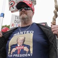 A supporter of former President Donald Trump protests at E. Barrett Prettyman U.S. Federal Courthouse, Thursday, Aug. 3, 2023, in Washington.