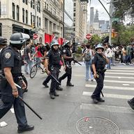 New York Police wearing riot gear patrol around Union Square, Friday, Aug. 4, 2023, in New York. Police in New York City are struggling to control a crowd of thousands of people who gathered in Manhat