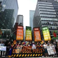 Climate activists block traffic on Park Avenue during a march protesting energy policies and the use of fossil fuels, in New York, Sunday, Sept. 17, 2023.
