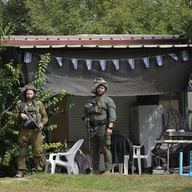 Israeli soldiers deploy in kibbutz Kfar Azza on Tuesday, Oct. 10, 2023. Hamas militants overran Kfar Azza on Saturday, where many Israelis were killed and taken captive.