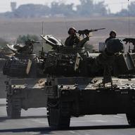 Israeli armored personnel carriers and tanks move towards the Gaza Strip border in southern Israel Wednesday, Nov.1, 2023.