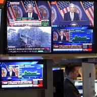 Federal Reserve Chairman Jerome Powell appears on several television screens on the floor of the New York Stock Exchange, Wednesday, Nov. 1, 2023.