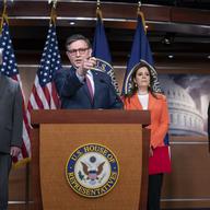 Speaker of the House Mike Johnson, R-La., center, talks with reporters ahead of the debate and vote on supplemental aid to Israel, at the Capitol in Washington, Thursday, Nov. 2, 2023.