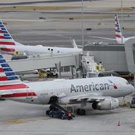 American Airlines planes sit on the tarmac at Terminal B at LaGuardia Airport, Jan. 11, 2023, in New York.