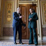 Senate Majority Leader Sen. Chuck Schumer, D-N.Y., presents Vice President Kamala Harris with a golden gavel after she cast the 32nd tie-breaking vote in the Senate.