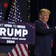 Former President Donald Trump greets supporters as he arrives at a commit to caucus rally, Tuesday, Dec. 19, 2023, in Waterloo, Iowa.