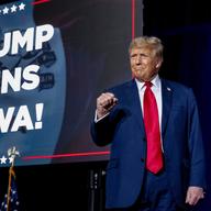 Republican presidential candidate former President Donald Trump takes the stage at a caucus night party in Des Moines, Iowa, Monday, Jan. 15, 2024. 