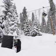 Vail Mountain Resort as snowboarders ride a lift, Wednesday, Dec. 29, 2021, in Vail, Colo. Newer snowmaking technology is allowing ski areas to be more efficient with energy and water usage.