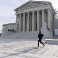 Attorney Lisa Blatt, of Williams & Connolly LLP, walks as she poses for a photograph in front of the Supreme Court, Monday, April 8, 2024, in Washington.
