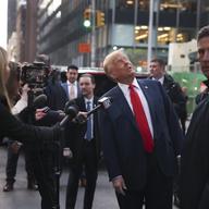Former President Donald Trump speaks members of the media while visiting with construction workers at the construction site of the new JPMorgan Chase headquarters in midtown Manhattan, Thursday, April