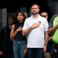 Republican vice presidential nominee, U.S. Sen. J.D. Vance (R-OH) and his wife Usha Vance (L) stand for the national anthem during a campaign stop...on September 14, 2024 in Greenville, North Carolina