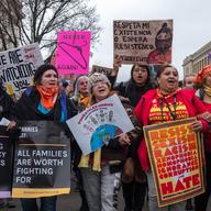Protestors march as part of the Women's March which nationwide campaigned for legislation and policies regarding human rights, women's rights, immigration reform, healthcare reform, the natural enviro