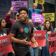  A climate activist seen leading chants at the rally. Climate activists held a rally outside Governor Kathy Hochul's office in Manhattan...