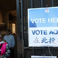 'Vote' signs are seen near an early voting site on October 25, 2025 in the Flatbush neighborhood of the Brooklyn borough in New York City. 