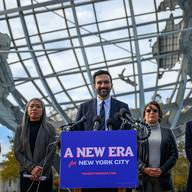Mayor-elect of New York City Zohran Mamdani (C) stands alongside members of his transition team, (L-R) Transition Co-chairs Melanie Hartzog, Maria Torres-Springer, Grace Bonilla and Lina Khan as he sp