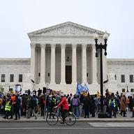 Members of the National TPS Alliance rally at the US Supreme Court in Washington, DC, on April 29, 2026. The Supreme Court is examining the revocation of Temporary Protected Status (TPS) for Haitian a