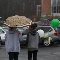 Families visit St. Rose church in Newtown, Conn., for Sunday mass, just two days after a deadly shooting at nearby Sandyhook Elementary School.