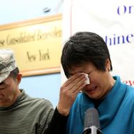 Pvt. Danny Chen's parents Yao Ten  and Su Zhen Chen speaking in Chinatown after the last courts-martial.