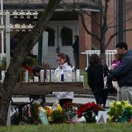Families visit St. Rose church in Newtown, Conn., for Sunday mass, just two days after a deadly shooting at nearby Sandyhook Elementary School.