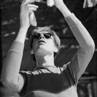 Andy Warhol hanging bananas from the ceiling of the Silver Factory in 1966. 