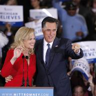 Republican presidential candidate and former Massachussetts Gov. Mitt Romney (R) and his wife Ann wave to supporters at a primary night gathering at the Suburban Collections Showplace on February 28, 