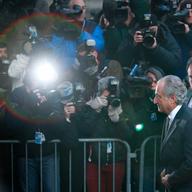 Disgraced financier Bernard Madoff passes a police barricade as he arrives at court on March 12, 2009 in New York City