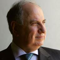 Iraqi Deputy Prime Minister and candidate for parliament Ahmed Chalabi looks from his office window December 5, 2005 in the Green Zone in Baghdad, Iraq.